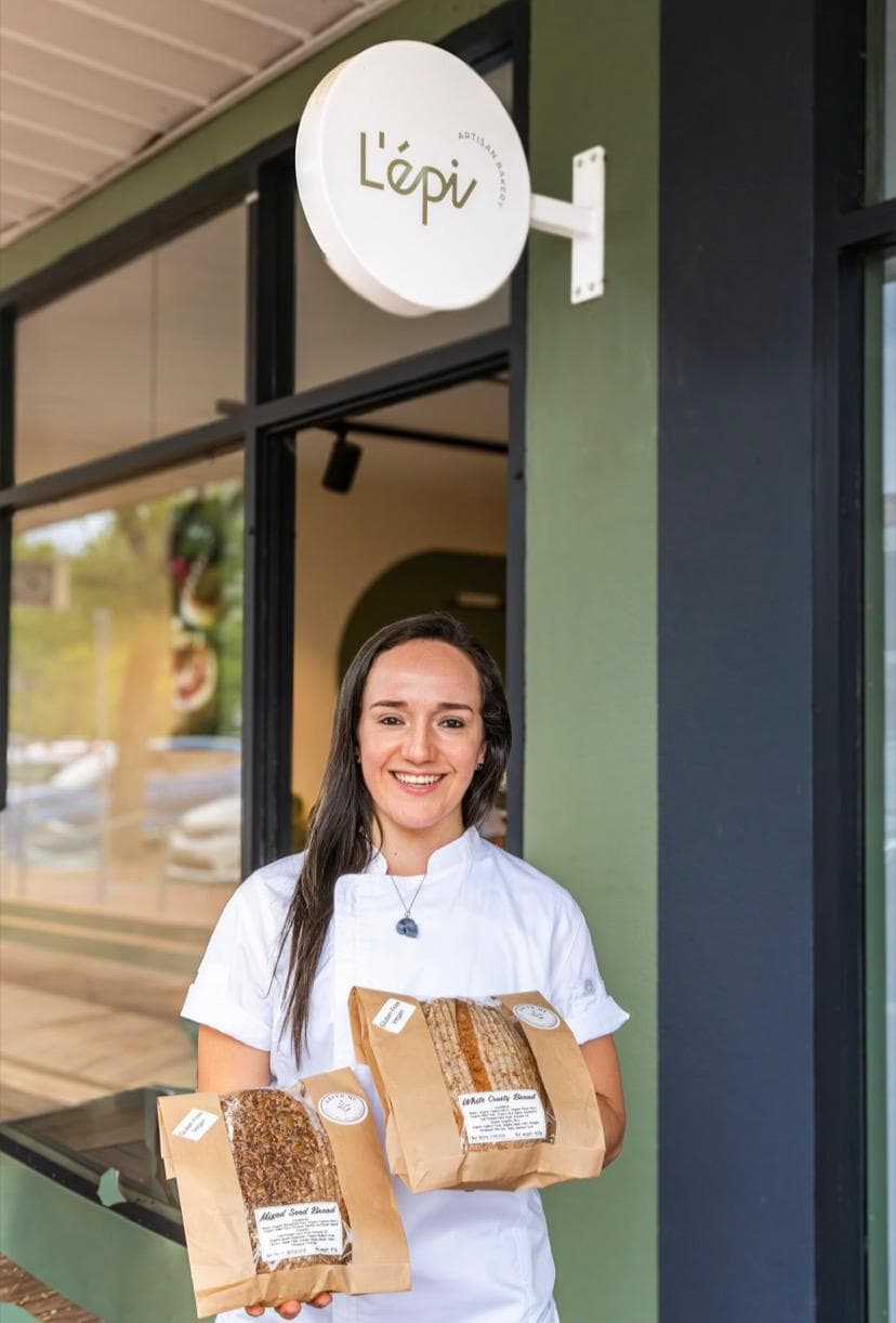A FREED.ME baker delivering fresh gluten-free loaves to a Canberra stockist